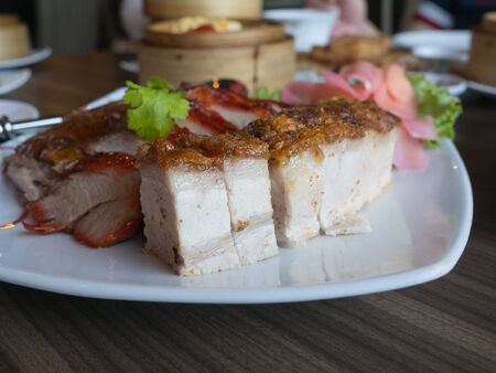 crispy pork, bbq pork and grilled duck on the plate, chinese foodの写真素材