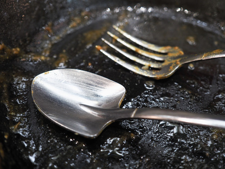 used spoon and fork (focus spoon)の写真素材