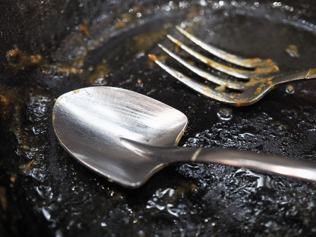 used spoon and fork (focus spoon)の写真素材