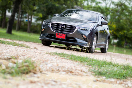 KANCHANABURI, THAILAND -July 9, 2021: Private car, Mazda cx3 Crossover. Skyactive-G. Machine Gray.  to prepare for travel, while parked on the ground off-road.のeditorial素材