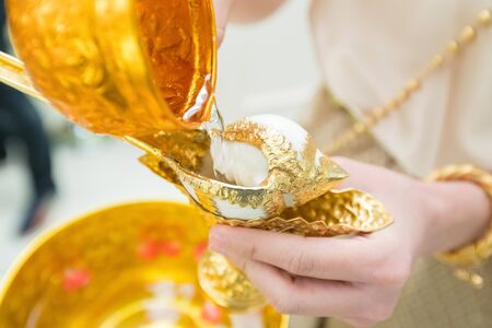 Watering The Conch Thai Traditional Wedding Ceremony Asian Culture for Artwork Designの写真素材