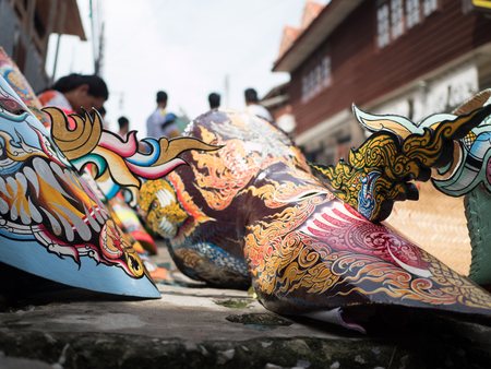 Ghost Festival (Phi Ta Khon) People are enjoying the costumes with colorful clothes made of wood. Painting on the mask is a local wisdom of Thailand.の写真素材