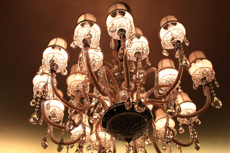 Large chandeliers hung on the ceiling in the hall.の写真素材