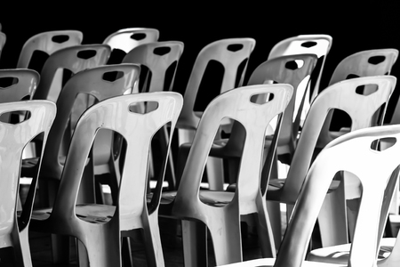 Plastic chair Stacked in the sun and in the shadow.の写真素材
