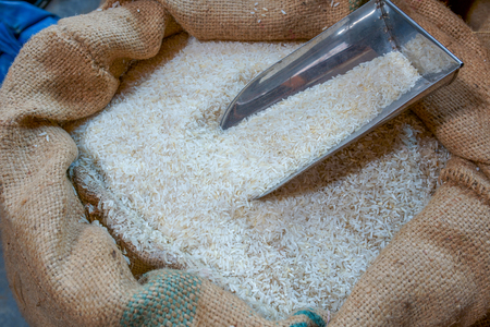 White rice in sackcloth isolated in the warehouse.の写真素材