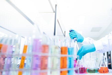 Scientific Glassware For Chemical,Laboratory Research Analysis Laboratory - Scientist With Pipette...