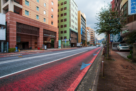 Kitakyushu, Japan - November 22, 2016 : Cars in Kitakyushu, Fukuoka Prefecture, Japan, City Road, with a few cars and small number of pedestrians In the morning the rain is going to fall in the fall.のeditorial素材