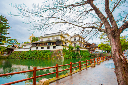 Kokura-jo Castle, Japanese Castle in Katsuyama Park, full of red leaves in autumn leaves at Kitakyushu, Fukuoka Prefecture, Japan, near the Riverwalk Department Storeのeditorial素材