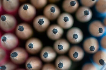 Close up front image of stacked pencils tip. shallow focus effect.の写真素材