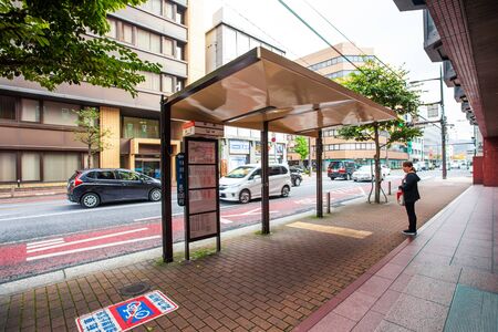 Kitakyushu, Japan - November 22, 2016 : Cars in Kitakyushu, Fukuoka Prefecture, Japan, City Road, with a few cars and small number of pedestrians In the morning the rain is going to fall in the fall.のeditorial素材