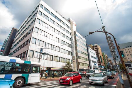 Kitakyushu, Japan - November 22, 2016 : Cars in Kitakyushu, Fukuoka Prefecture, Japan, City Road, with a few cars and small number of pedestrians In the morning the rain is going to fall in the fall.のeditorial素材