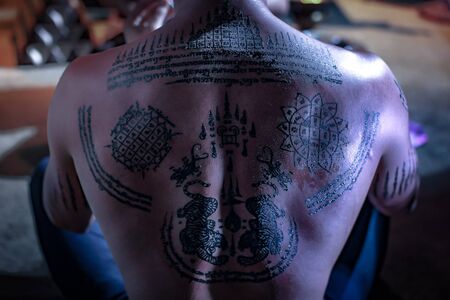 Thai Tattoo black magic talisman.Belief in magic.shallow focus effect.perform black magic like Thai, Asian.soft focus.の写真素材