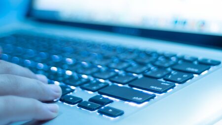 Laptop keyboard with lights and finder.Keyboard close up.shallow focus effect.の写真素材