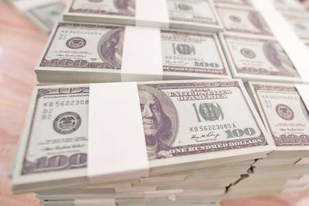 American Dollars Cash Money. One Hundred Dollar Banknotes. Stack of one hundred dollar bills .shallow focus effect.の写真素材