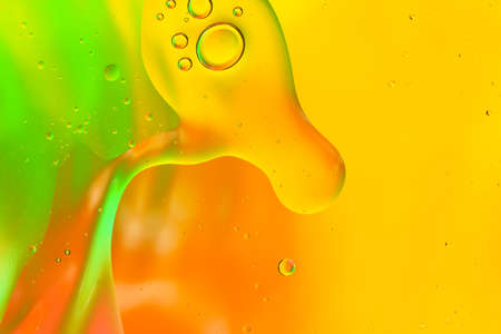 Colorful of oil drop floating on the water.Fantastic structure of colorful oil bubbles.