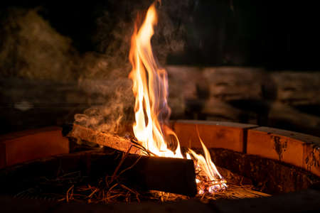 fire and flames. Flames and burning sparks close up, fire patterns. flames from the fire. Night bonfire, logs are on fire, sparks fly.soft focus.の写真素材