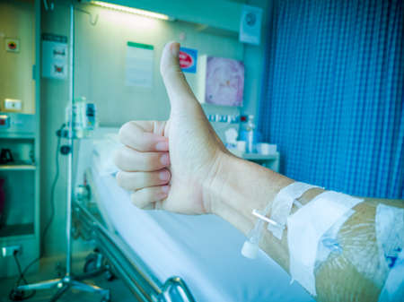 patients Coronavirus, the Covid-19  raise fingers fighting between them. The treatment to normal in the hospital.soft focus.shallow focus effect.の写真素材