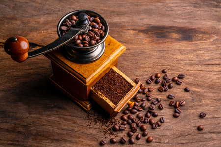 Vintage coffee grinder.Old retro hand-operated wooden and metal coffee grinder.Manual coffee grinder for grinding coffee beans. soft focus.の写真素材