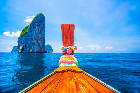 Front view of Longtail boat at Phi Phi Islands sea Asia Thailand, wooden boat in the middle of the...