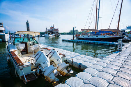 KRABI, THAILAND -28 March 2022: passenger jetty to travel to Phi Phi Island, boat trips at sea, Clean white sand beaches, and emerald green sea.のeditorial素材