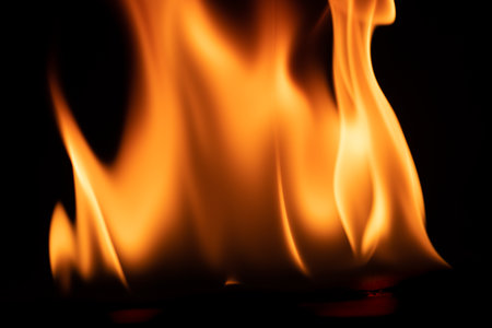 burning power of the flame, Flames, and burning sparks close-up, fire patterns, the glow of fire in...