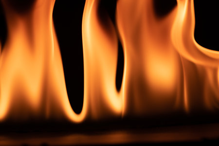 burning power of the flame, Flames, and burning sparks close-up, fire patterns, the glow of fire in...