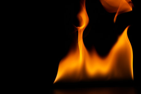 burning power of the flame, Flames, and burning sparks close-up, fire patterns, the glow of fire in the darkの写真素材