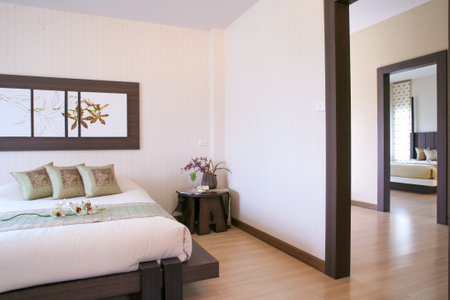 BANGKOK, THAILAND - August 31, 2006: luxury bedroom interior with natural decoration large glass window overlooking the view outside. selective focus, soft focus.のeditorial素材