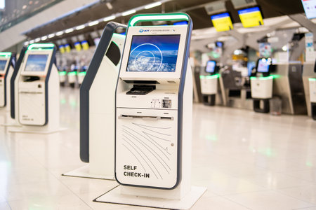 BANGKOK, THAILAND - January 21, 2023: Self-service check-in machine at Check-in counters at Suvarnabhumi International Airportのeditorial素材