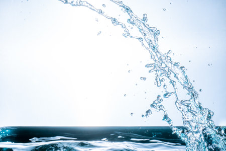 splashing water droplets on a white backgroundの写真素材