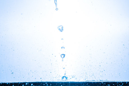 splashing water droplets on a white background