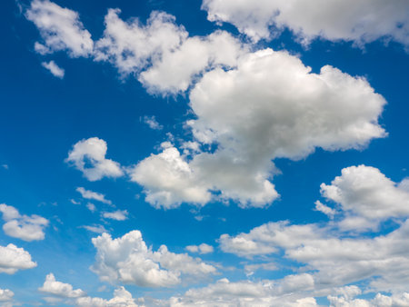 clouds and blue sunny sky,  white clouds over blue sky, Aerial view,  nature blue sky white cleat weather.の写真素材