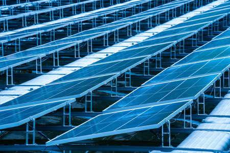 Side view of solar panels floating on water in a lake, for generating electricity from sunlight, selective focus, soft focus.の写真素材