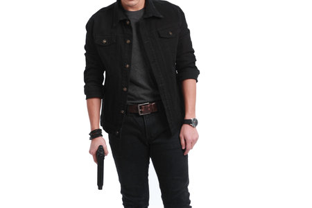man holding a gun like a secret agent on a white background