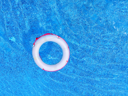 Inflatable ring in swimming pool on sunny day. Top viewの写真素材