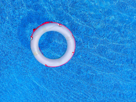 Swimming pool with inflatable ring on sunny day. Top viewの写真素材