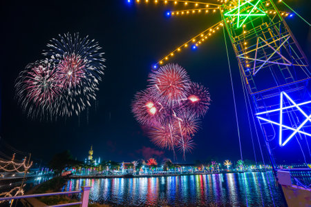 Colorful lights in the outdoor amusement park at night, Temple fair is an annual traditional festival, There is a place for religious ceremonies, Thai traditional food, and a local theme park.の写真素材