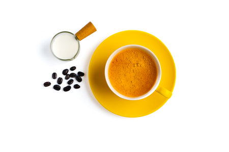Yellow coffee cup and fresh milk cup on a white backgroundの写真素材
