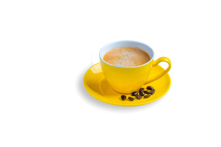 Yellow coffee cup isolated on white backgroundの写真素材