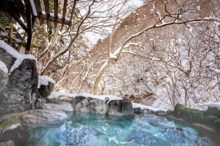 The mountain background is covered with a lot of snow. In winter in Japanの写真素材