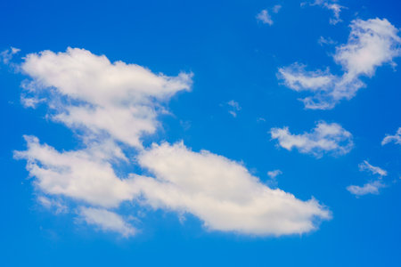 clouds and blue sunny sky,  white clouds over blue sky, Aerial view,  nature blue sky white cleat weather.の写真素材