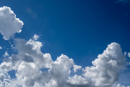 clouds and blue sunny sky,  white clouds over blue sky, Aerial view,  nature blue sky white cleat weather.の写真素材