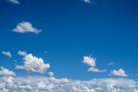 clouds and blue sunny sky,  white clouds over blue sky, Aerial view,  nature blue sky white cleat weather.の写真素材