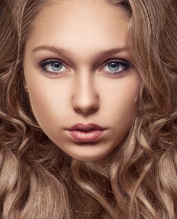 close-up portrait of beautiful young girl with brown hair and perfect skiinの写真素材