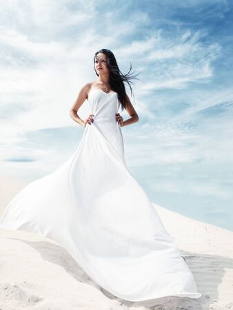 in a wedding dress, by the seaの写真素材