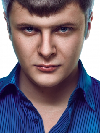 portrait of man in blue shirt on white backgroundの写真素材