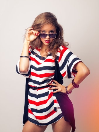 pretty woman in sunglasses in studioの写真素材