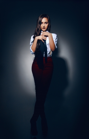 Full legth portrait of beautiful girl in studio の写真素材