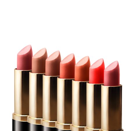colored lipstick standing in a row on white backgroundの写真素材