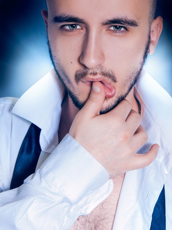 head and shoulders portrait of a beauty adult man in studio の写真素材